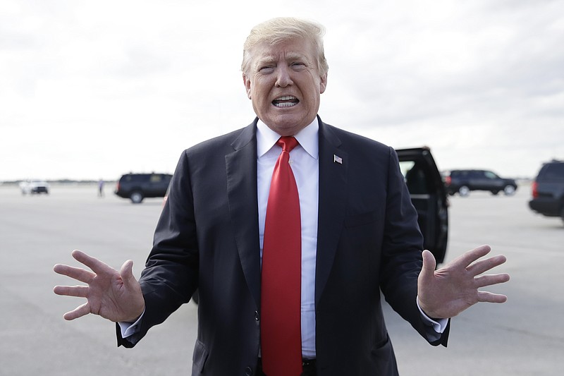 President Donald Trump boards Air Force One, Sunday, March 24, 2019, at Palm Beach International Airport, in West Palm Beach, Fla., en route to Washington. (AP Photo/Carolyn Kaster)