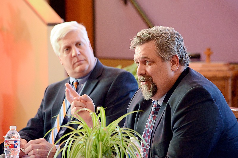 Municipal judge candidates Brian Stumpe, front, answers questions Monday with Tim Anderson during a candidate forum at Quinn Chapel A.M.E. Church. 