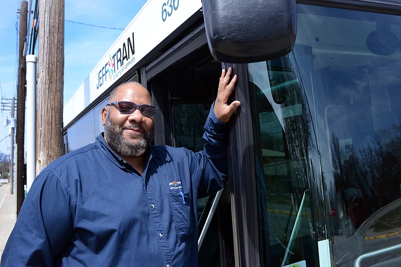 Sally Ince/ News Tribune
Assistant Operations Manager Maurice Burnley stands next to a city bus Wednesday March 27, 2019 outside the Jefferson City Transit Division. Burnley was awarded the city's Employee Service Award for March.