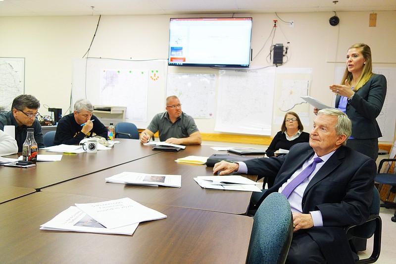 Courtney Wegman, right, vice president of LJ Hart & Company, and President and CEO Larry Hart talk to members of the jail community advisory committee. Their research suggests two half-cent sales taxes will fund a new justice center and its upkeep.
