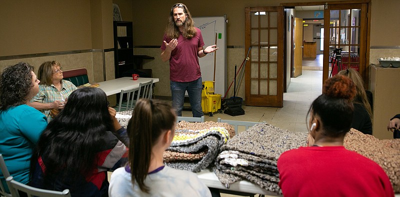 Mission Texarkana Executive Director Cody Howard speaks Wednesday to Ashdown, Ark., students who donated plastic bag mats to the shelter in Texarkana, Texas. He talked about what each student could do to help the homeless more and what he experiences every day at work. The Ashdown students were placed in focus groups, with each one choosing a project to work on. This group decided to make mats from recycled grocery bags for the homeless to sleep on.