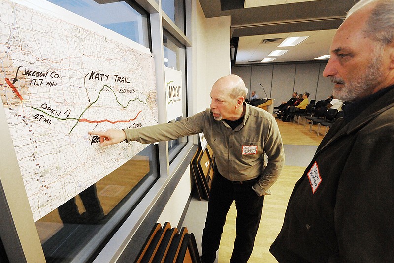 Councilman Rick Mihalevich, left, and Gregory Brunkhorst look at the proposed Rock Island Trail through Central Missouri during a meeting Thursday, March 28, 2019, at The LINC in Jefferson City. 