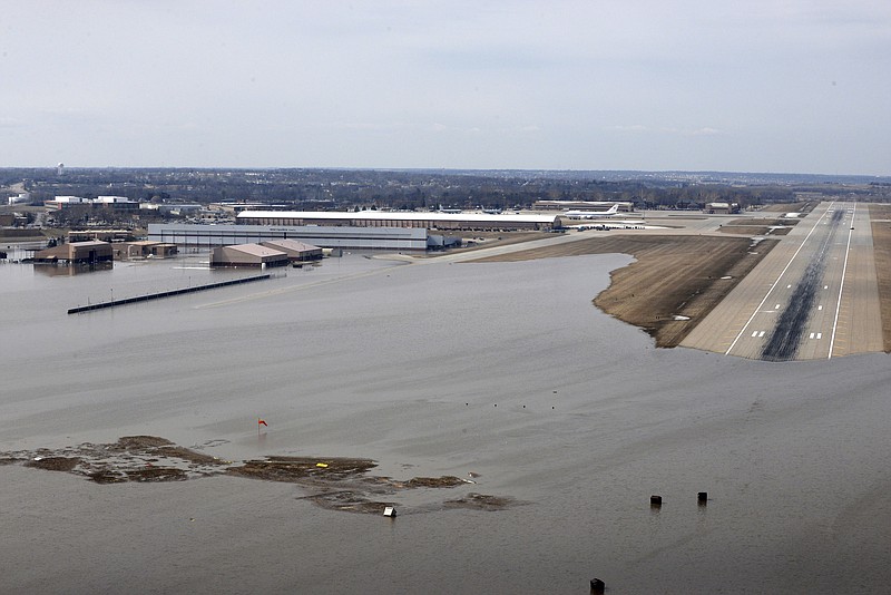 FILE - This March 17, 2019 file photo provided by the U.S. Air Force shows an aerial view of Offutt Air Force Base and surrounding areas in Nebraska affected by flood waters. After this spring's massive flooding along the Missouri River, many want to blame the agency that manages the river's dams for making the disaster worse, but it may not be that simple. The U.S. Army Corps of Engineers says much of the water that created this month's flooding came from rain and melting snow that flowed into the river downstream of all the dams, and at the same time, massive amounts of water filled the reservoirs and some had to be released. (Tech. Sgt. Rachelle Blake/U.S. Air Force via AP, File)