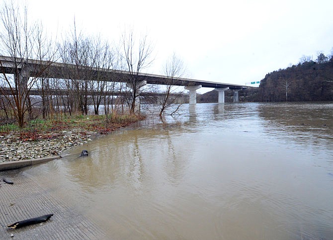 A swollen Osage River on Saturday flows swiftly by the Mari-Osa Public Fishing Access near U.S. 50. The Osage River at Mari-Osa crested Saturday, at 22.3 feet (3.2 feet above flood stage).
