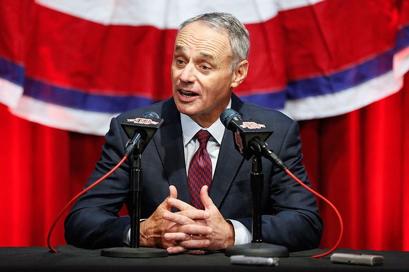 Major League Baseball  commissioner Rob Manfred speaks to reporters before an opening day game between the Reds and the Pirates on Thursday in Cincinnati. 