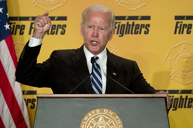Former Vice President Joe Biden speaks March  12 to the International Association of Firefighters at the Hyatt Regency on Capitol Hill in Washington. Biden says he does not recall kissing a Nevada political candidate on the back of her head in 2014. 