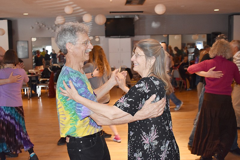 Peter Price, of Rolla, and Debora Dee, of Iowa City, Iowa, dance at Sunday's 18th annual Spring Breakdown Contra Dance Weekend, sponsored by Mid-Missouri Traditional Dancers. Several dozen dancers from around the Midwest attended the event at Capital Ritz.
