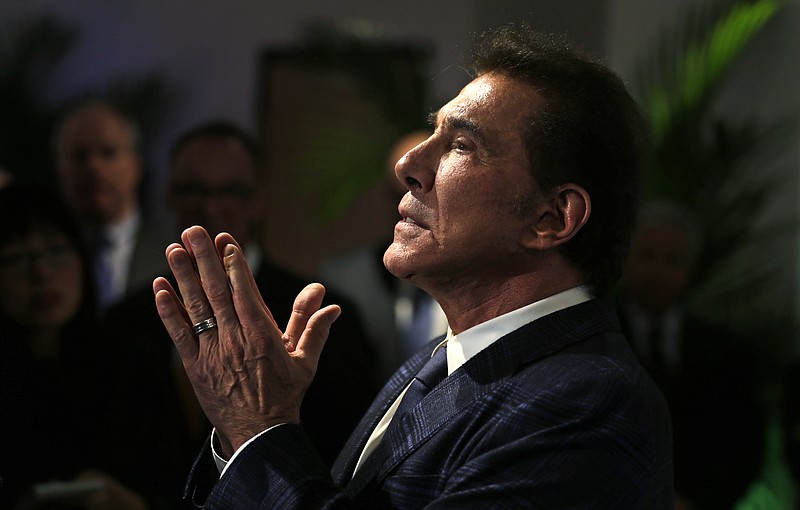 FILE - In this March 15, 2016 file photo, casino mogul Steve Wynn gestures during a a news conference in Medford, Mass., regarding his proposed casino complex. Women's rights advocates and business experts said Wynn Resorts has taken laudable steps to transform a workplace culture that allowed sexual misconduct complaints against Wynn, its founder, to remain hidden for decades, but still has room for improvement. The Massachusetts Gaming Commission will holding public hearings the first week of April 2019 on whether the company is still suitable to hold a casino license for the multi-billion dollar Encore Boston Harbor, slated to open in June 2019 in Everett, Mass. (AP Photo/Charles Krupa, File)