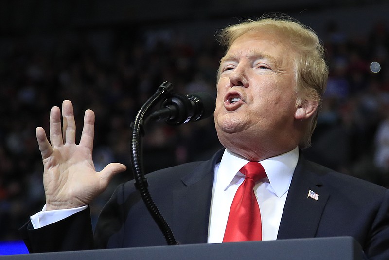 In this March 28, 2019 photo, President Donald Trump speaks at a campaign rally in Grand Rapids, Mich. Trump is suggesting he will defer until after 2020 his push for a Republican health care plan to replace the Affordable Care Act. Trump tweeted late Monday that Congress will vote on a GOP plan after the elections, ”when Republicans hold the Senate & win back the House.”  (AP Photo/Manuel Balce Ceneta)