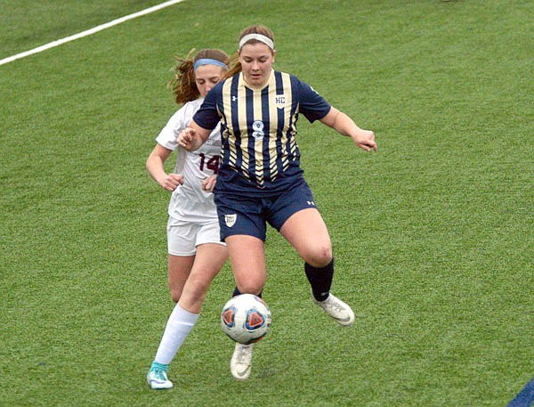 Helias senior Maggie Winegar tries to gain control of the ball against Rolla sophomore Mercedez Carpenter during Wednesday's game at the Crusader Athletic Complex.