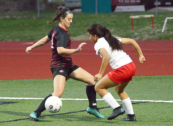 Jefferson City sophomore Delaney Kaiser tries to move the ball past a Union player during Wednesday's game at Dwight T. Reed Stadium.