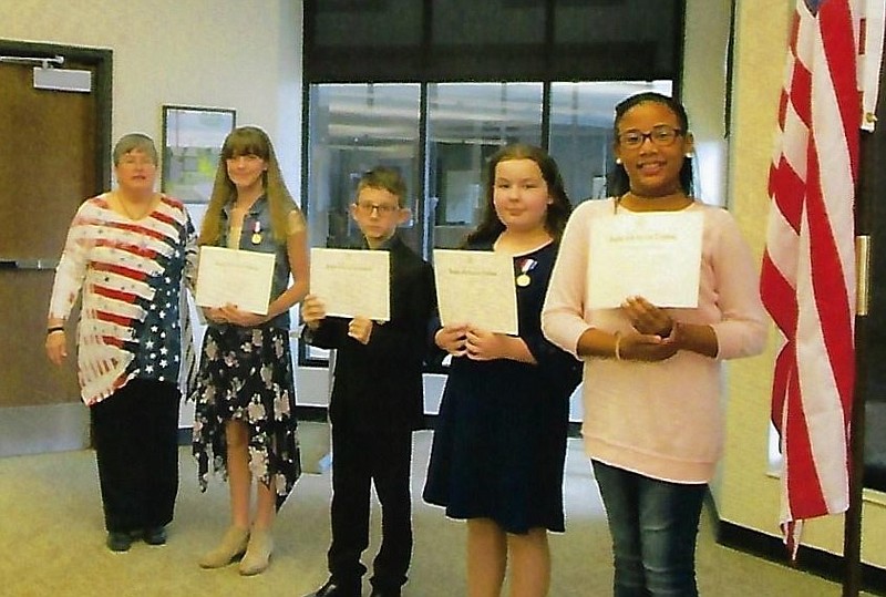 <p>Submitted</p><p>Left: Lori Franklin presented the fifth-grade Youth Citizens shown here left to right: Ava Santhuff, St. Peters; Quade Michael Edwards, New Bloomfield; Ainsley Armstrong, Hatton-McCredie; and Dezteni Galbreath Chambers, Bush. Not pictured Ava Miller, Bartley. Right: The American History Essay Contest winners included Madeleine Cerneka 8th grade, Nancy Allbritton, 7th grade, Ava Martin, 6th grade and Brooke Czeschin, 5th grade. Below: This years DAR Good Citizens were Patrick Distler, New Bloomfield, and Daniel McDonald, South Callaway.</p>