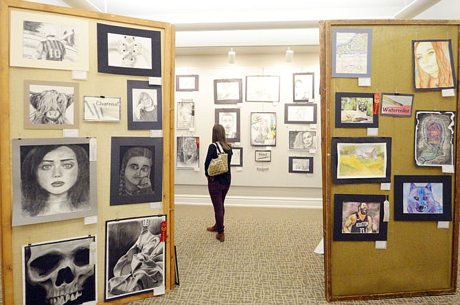 Art aficionados attend a reception Thursday during the Show-Me Conference Art Show at the Miller Performing Arts Center. The show continues through Monday.