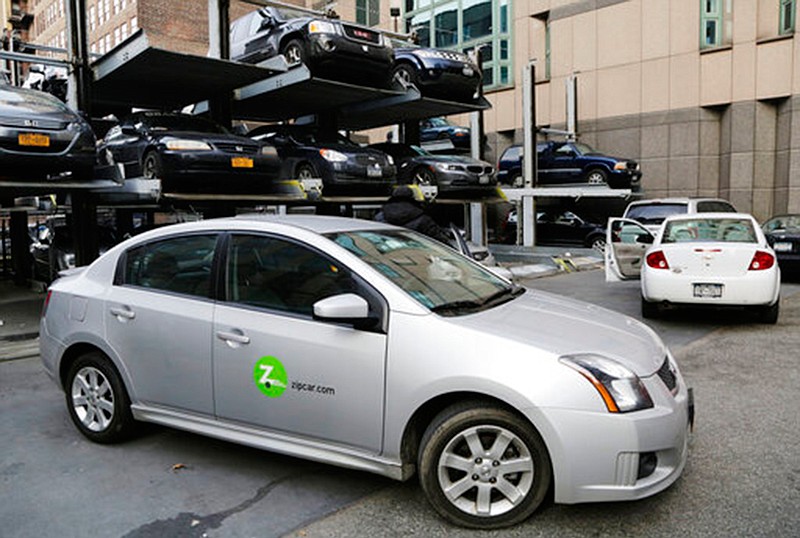 ABOVE:
A Zipcar is parked at a lot in New York on Jan. 2, 2013. Companies such as Zipcar and car2go eliminate the need to stand in line at rental car counters while waiting for vehicles, instead using smartphone apps to connect drivers with cars in their neighborhoods or nearby.

