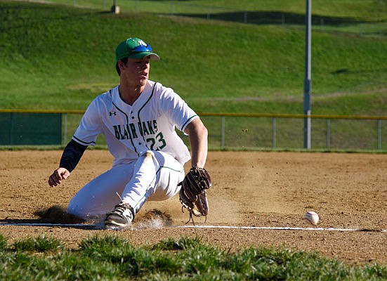 Blair Oaks third baseman Reid Dudenhoeffer goes down to field a grounder during Monday's game against Fulton at the Falcon Athletic Complex in Wardsville.