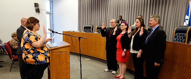 Fulton Clerk Courtney Crowson swears in new members of the Fulton City Council on Tuesday, including Rick Shiverdecker (left), Lindsey Pace-Snook, Valerie Sebacher and Jeff Stone.