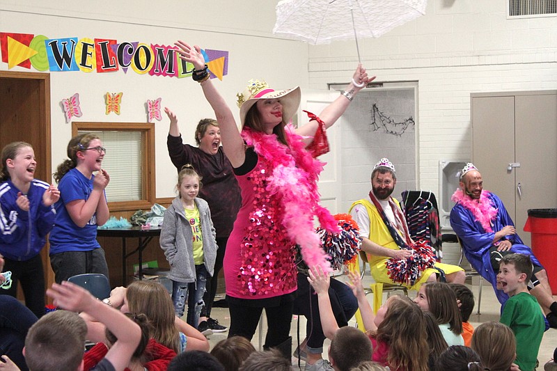 Dyan Ingram, a fourth-grade teacher at California Elementary School, won this year's Read-a-Thon on April 5. The students who read the most minutes and earned the most money for the school had the chance to spend five minutes decorating three teachers and principals in over-the-top costumes for their reading and money-raising efforts.