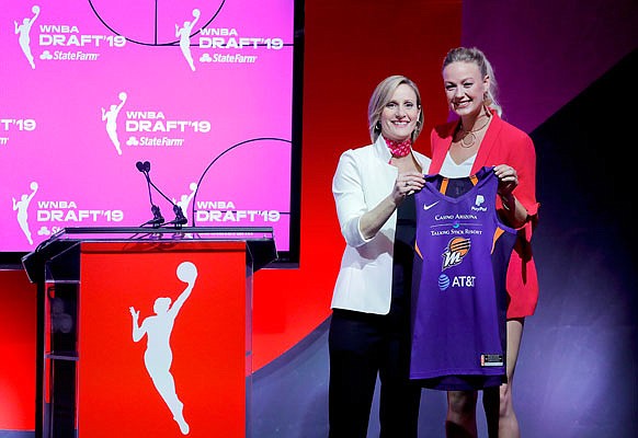 Sophie Cunningham poses with WNBA COO Christy Hedgpeth after being selected by the Phoenix Mercury in the second round of Wednesday night's WNBA draft in New York.