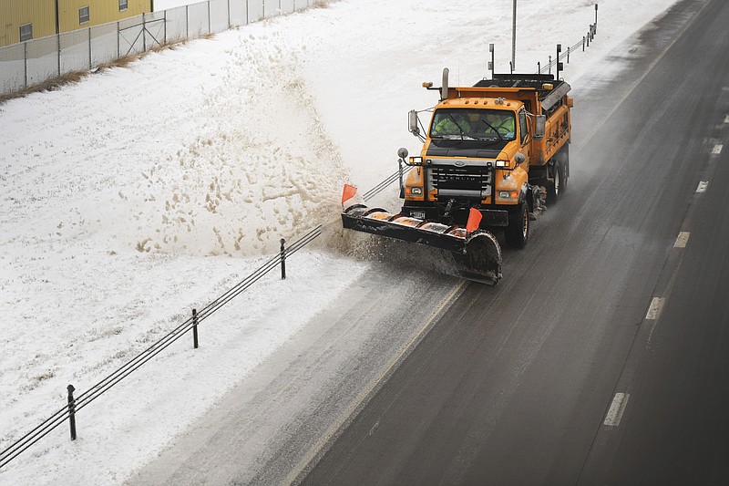 Snow plows clear Interstate 29 on Thursday, April 11, 2019, in Sioux Falls, S.D. Heavy snow and strong winds hammered parts of the central U.S. on Thursday, knocking out power to tens of thousands of people and creating hazardous travel conditions a day after pummeling Colorado. (Briana Sanchez/The Argus Leader via AP)