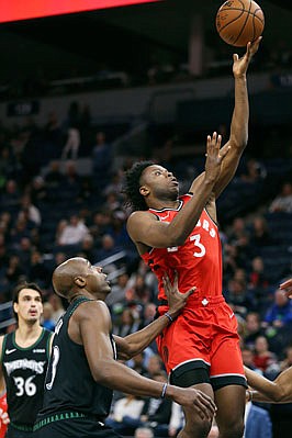OG Anunoby of the Raptors puts up a shot during Tuesday's game against the Timberwolves in Minneapolis. Anunoby, a former Jefferson City Jay, will miss the start of the playoffs after having an emergency appendectomy Thursday. 