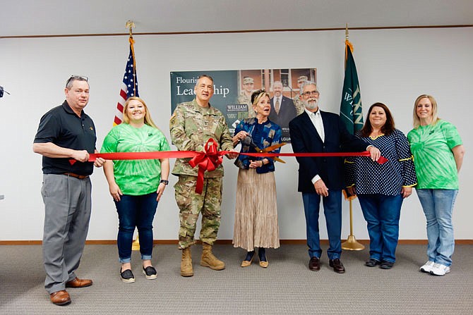 Members of the Callaway Chamber of Commerce joined Maj. Gen. Stephen Danner, William Woods University President Jahnae Barnett and chair of the WWU Board of Trustees John Edwards to cut the ribbon for the school's new Show-Me GOLD Program space.