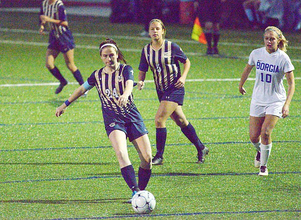 Olivia Farrow of Helias pushes the ball up the field during Friday's game against Borgia in the Helias Soccer Shootout at the Crusader Athletic Complex.