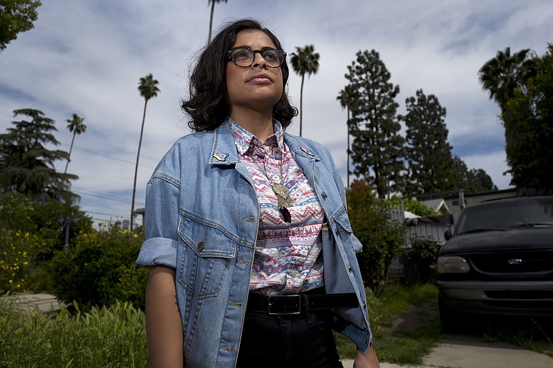 In this April 8, 2019 photo, Naia Al-Anbar stands on a street in the Glendale section of Los Angeles. Anbar, who generally supports the idea of a new category, on the 2020 census said. "The truth is we aren't ever going to be white in their eyes and we will still be discriminated against." Al-Anbar, who has a Saudi Arabian father, would mark "other" on the census if a more precise category isn't offered. (AP Photo/Richard Vogel)