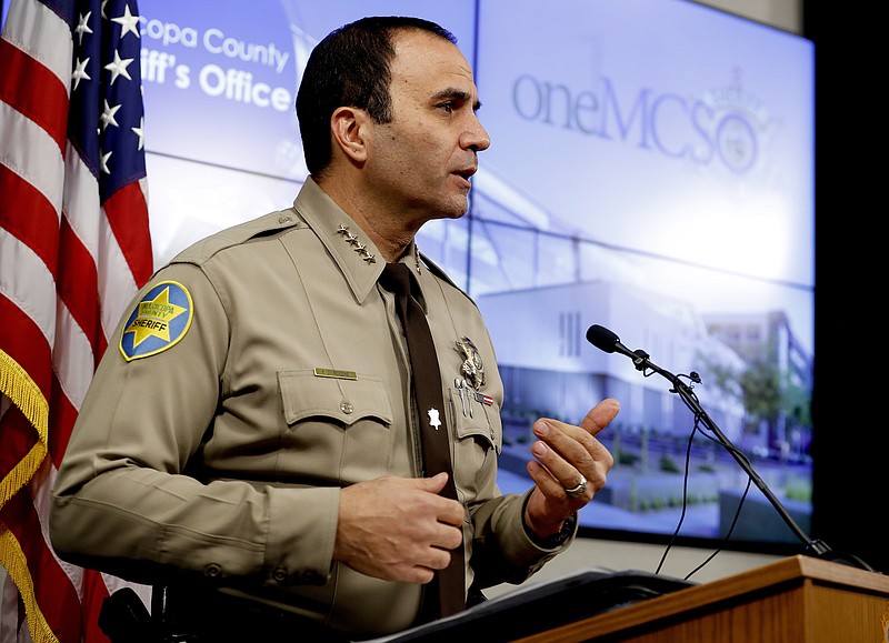 FILE - This Feb. 14, 2019, file photo, shows Maricopa County Sheriff Paul Penzone at a news conference in Phoenix. Officers at the sheriff's office in metro Phoenix have made 52% fewer traffic stops in the years since a judge concluded they had racially profiled Latinos in then-Sheriff Joe Arpaio’s immigration patrols.  Penzone, and others tell The Associated Press that the decrease is driven by officers’ fears that they’ll be unfairly scrutinized in a court-ordered overhaul that’s aimed at ridding the agency of its biased policing. (AP Photo/Matt York, file)