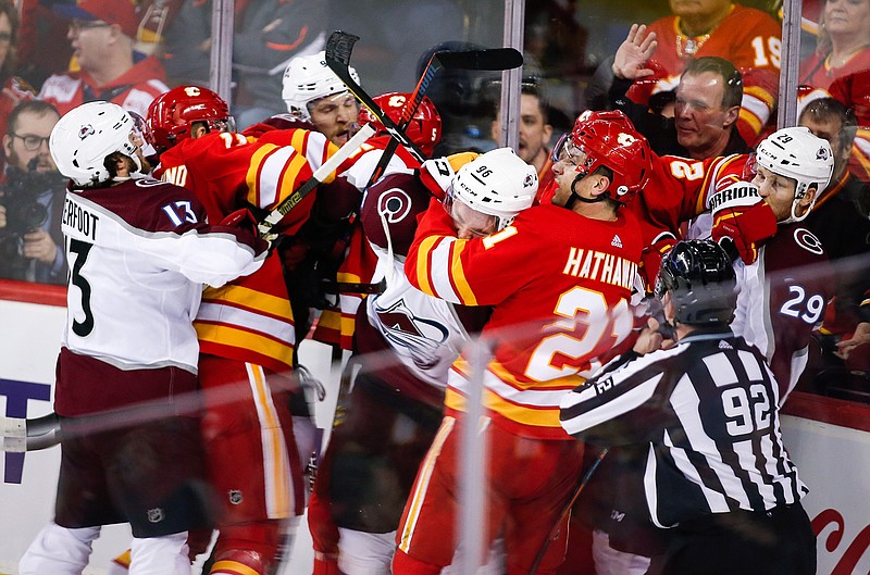  Colorado Avalanche and Calgary Flames players tussle during Game 2 of an NHL first-round playoff series Saturday in Calgary, Alberta. 