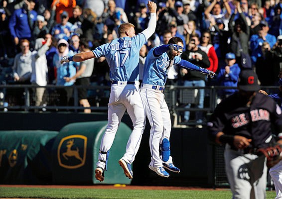 Hunter Dozier celebrates his winning hit with Royals teammate Chris Owings after Sunday afternoon's 9-8 win against the Indians at Kauffman Stadium.