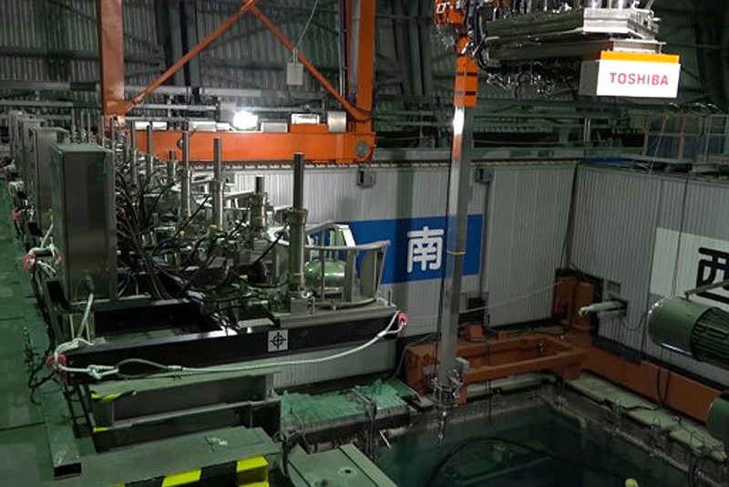 This image released by Tokyo Electric Power Co. (TEPCO) shows the operation floor above a cooling pool at Unit 3 of the Fukushima nuclear power plant in Okuma town, Fukushima prefecture, northeastern Japan, Monday, April 15, 2019. The operator TEPCO of the tsunami-wrecked Fukushima nuclear plant began removing fuel from the cooling pool at one of three reactors that melted down in the 2011 disaster, a milestone in the decades-long process to decommission the plant. (Tokyo Electric Power Co. via AP)