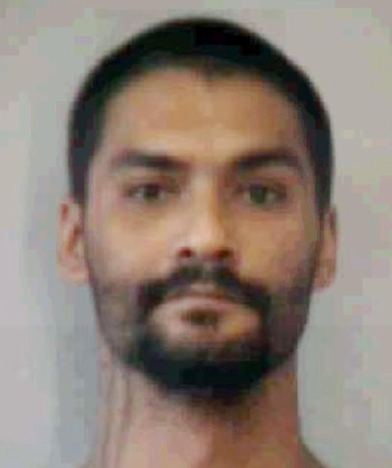 This undated booking photo provided by the Hawaii Department of Public Safety shows Troy Diego. Diego is one of two inmates who escaped from a Maui jail Sunday, April 14, 2019. He and Barret Paman escaped from Maui Community Correctional Center. Authorities say staff members later noticed a broken door in the back of a dorm building. Paman later turned himself in to Maui police. He's awaiting trial for burglary, theft and firearms charges. Diego remained missing Monday. He's awaiting trial for theft and unauthorized entry into a vehicle. (Hawaii Department of Public Safety via AP)