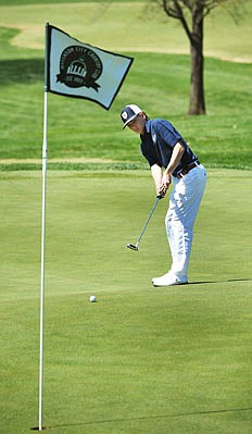 Cole Sappenfield of Helias rolls a putt toward the hole Monday during the Helias Invitational at Jefferson City Country Club.