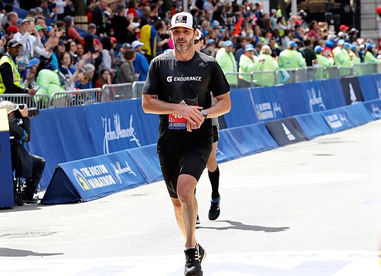 Jimmie Johnson finishes the 123rd Boston Marathon on Monday in Boston.