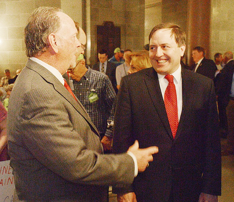 Secretary of State Jay Ashcroft, right, speaks to Missouri Farmers Care Chairman Gary Marshall during a rally Tuesday at the Capitol to support House Bill 1062 and Senate Bill 391, two bills relating to farmers property rights. 