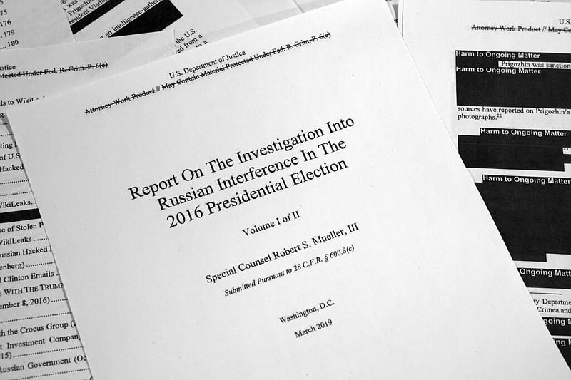 Special counsel Robert Mueller's redacted report on Russian interference in the 2016 presidential election as released on Thursday, April 18, 2019, is photographed in Washington.