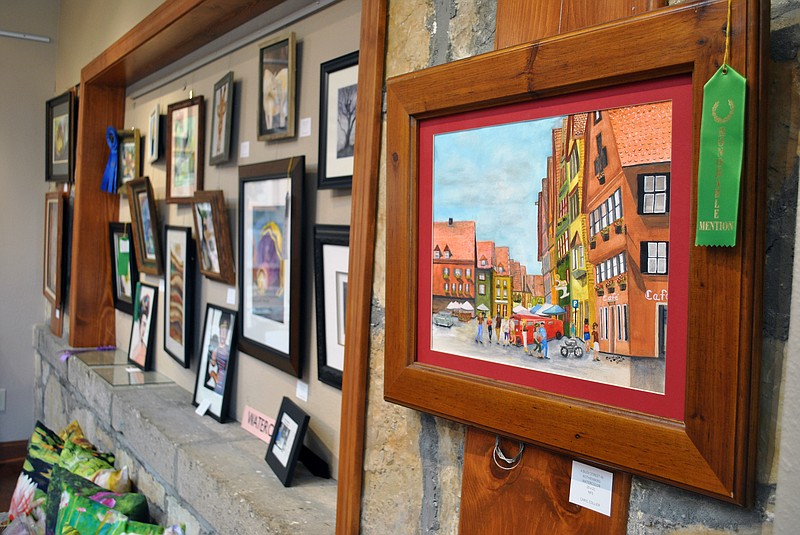 <p>Samantha Pogue/News Tribune</p><p style="text-align:right;">Caryl Collier’s “A Busy Street in Rothenberg” earned an honorable mention in the amateur watercolor category and is displayed along with several other pieces of art in the Jefferson City Art Club’s Adult Fine Arts Show.</p>