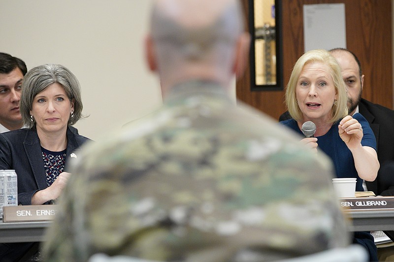 Sen. Kirsten Gillibrand, D-N.Y., right, directs a question to Maj. Gen. Scott Spellmon, deputy commanding general, civil and emergency operations of the U.S. Army Corps of Engineers, center, as Sen. Joni Ernst, R-Iowa, left, listens, during a field hearing of the Senate Committee on Environment and Public Works, in Glenwood, Iowa, Wednesday, April 17, 2019. The hearing was called to investigate the U.S. Army Corps of Engineers' Management of the 2019 Missouri River Basin Flooding. (AP Photo/Nati Harnik)