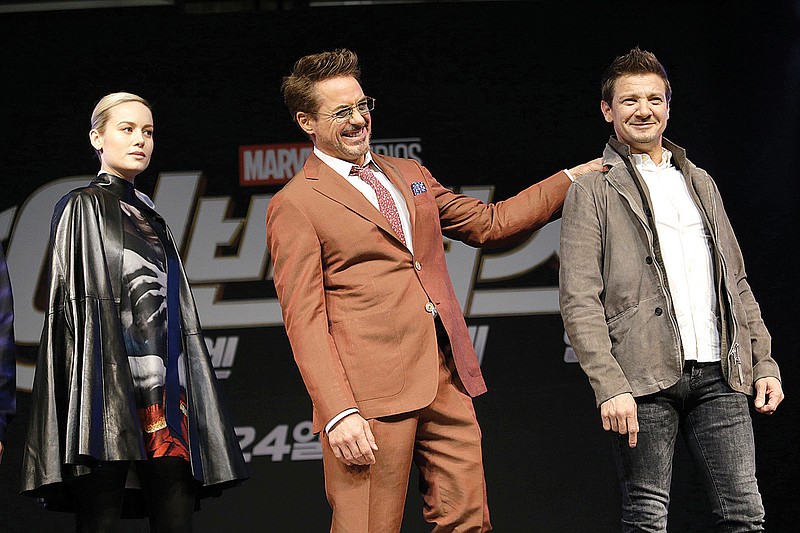 Actor Robert Downey Jr., center, poses with actor Jeremy Renner, and actress Brie Larson during an Asia Press Conference to promote their latest film "Avengers Endgame" in Seoul, South Korea, Monday, April 15, 2019. The movie will open on April 24 in South Korea. (AP Photo/Ahn Young-joon)