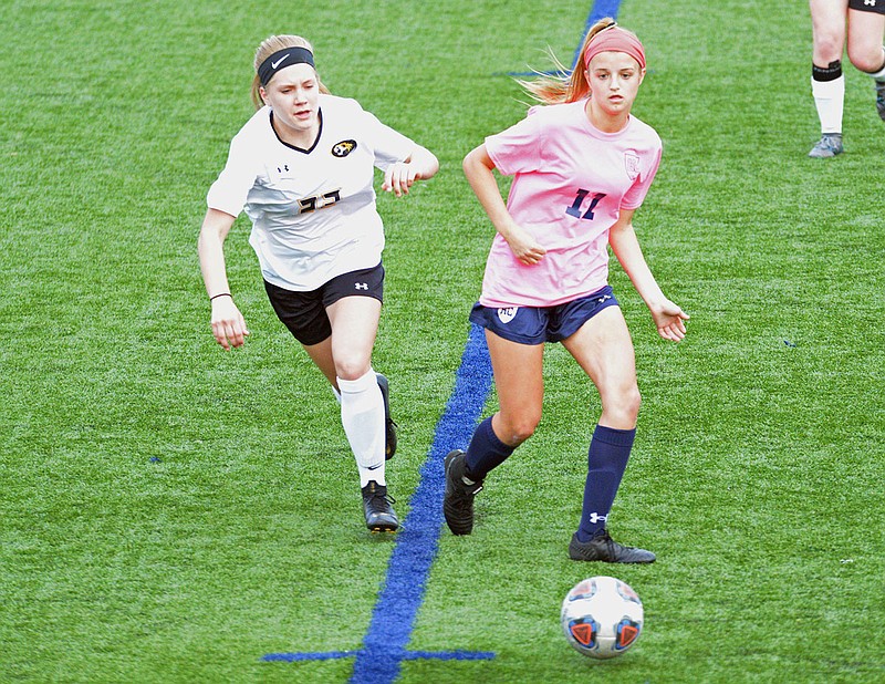 Izzy Luebbert (right) of Helias controls the ball during Wednesday's game against Sedalia Smith-Cotton at the Crusasder Athletic Complex.