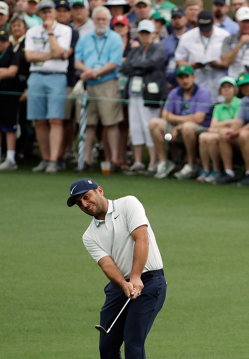 Francesco Molinari, of Italy, hits from the second fairway during the final round for the Masters golf tournament Sunday, April 14, 2019, in Augusta, Ga. (AP Photo/Chris Carlson)