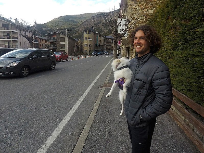 Argentina's Marco Trungelliti holds his dog in the principality of Andorra Monday, April 8, 2019. Blowing the whistle on betting-related corruption that is eating at tennis' credibility has come at a cost for the Argentine whose mad-dash road trip to Roland Garros last year caused a sensation. (AP Photo/John Leicester)