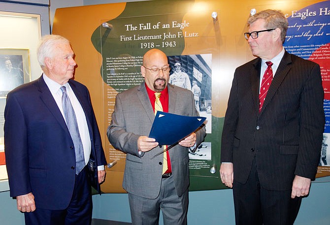 Flanked by Westminster College President Fletcher Lamkin, left, and Tim Riley, director of the National Churchill Museum, new Fulton Mayor Lowe Cannell presented a proclamation Thursday making May 4 "1st Lt. John Frederick Lutz Day" as part of the 50th anniversary celebration planned May 3-4.