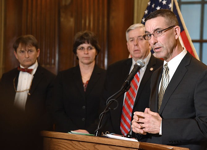 Steve Corsi, right, director of Department of Social Services, addresses the media during a March 4, 2019, press conference in Governor Mike Parson's office. Standing in the background are Dr. Randall Williams, director of Department of Health and Senior Services; Sandra Karsten, director of Department of Public Safety and Gov. Mike Parson. 