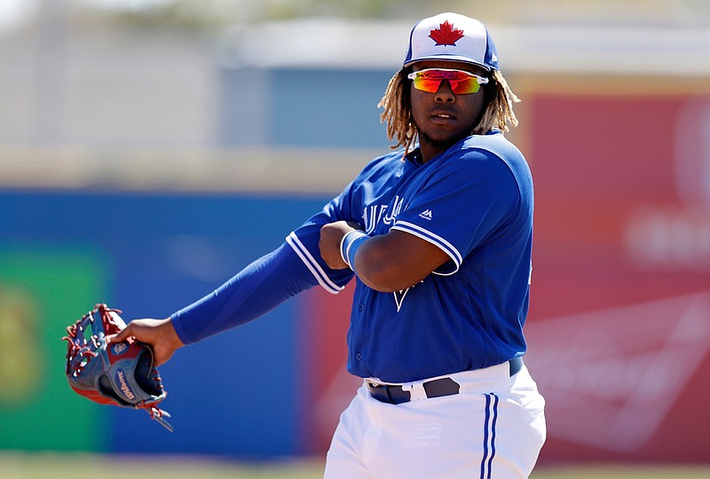In this March 6, 2019, file photo, Toronto Blue Jays third baseman Vladimir Guerrero Jr. watches during the second inning of a spring training baseball game against the Philadelphia Phillies in Dunedin, Fla. The Blue Jays top prospect says he feels ready to finally make the jump to the majors, while adding the decision is out of his control. Blue Jays assistant general manager Joe Sheehan said this week the team is still evaluating when to make the move. (AP Photo/Chris O'Meara, File)