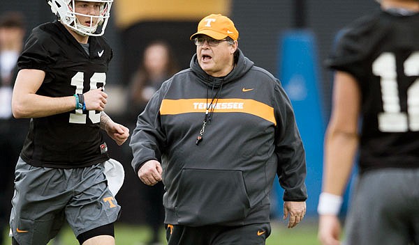 Tennessee offensive coordinator Jim Chaney walks on the field during the first football practice of the spring last month in Knoxville, Tenn.