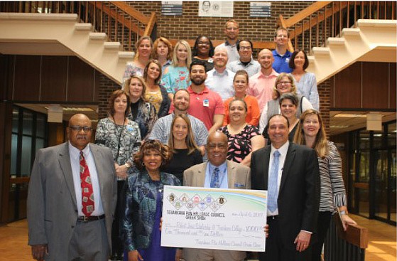 The Texarkana Panhellenic Council recently donated $1,000 to the Texarkana College Foundation as a lead gift to the Robert A. Jones Scholarship fund. The money was raised through the annual Greek Show, which was held April 6. Shown are, front row from left, Al Davis, JoAnn Rice, Robert Jones and Dr. Jason Smith. Members of Texarkana College faculty and staff are also pictured. (Submitted photo)
