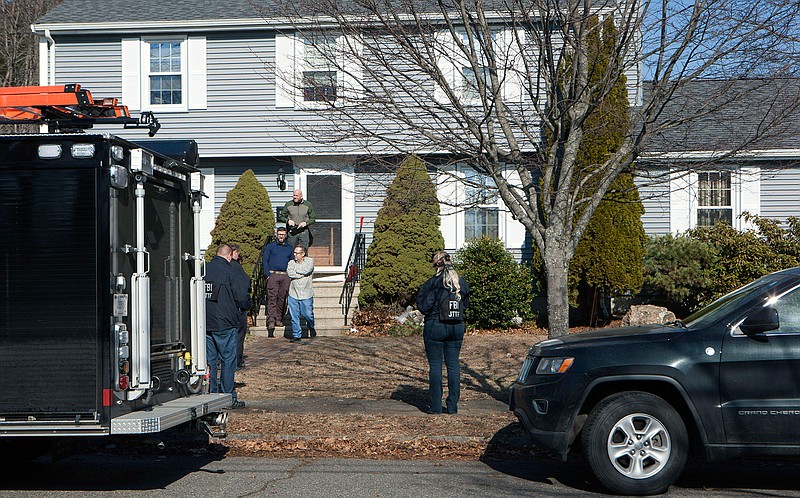 In this March 1, 2018 file photo, the FBI's Joint Terrorism Task Force descended on a home in Beverly, Mass., where Daniel Frisiello lives with his parents. Prosecutors are seeking three years in prison for a Massachusetts man who admitted to sending threatening letters filled with white powder to President Donald Trump's sons and others. Daniel Frisiello is set to be sentenced Friday, April 19, 2019, in Boston federal court. (Amy Sweeney/The Salem News via AP)