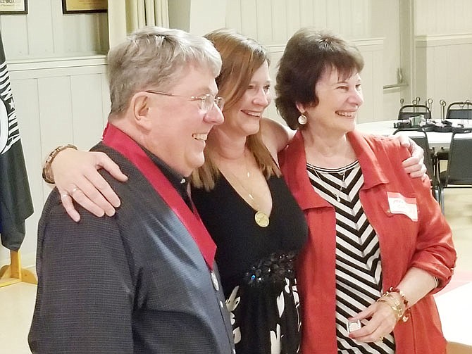 Lt. Col. (ret.) John Walters, left, presents Latisha Koetting, center, and her mother, Marty Carson, with the Artillery Order of Molly Pitcher medal during the recent dining out of the local chapter of the U.S. Field Artillery Association held at the American Legion Post 5 in Jefferson City. 