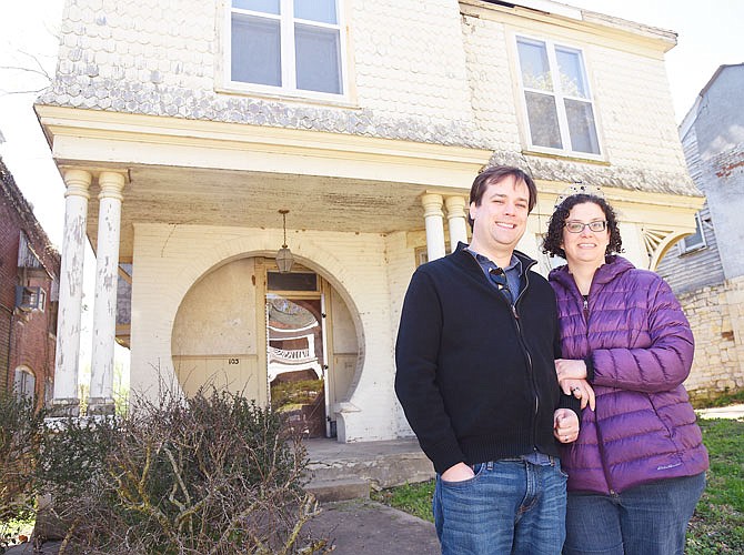 Levi and Amanda Burke Williams pose outside of the Standish House at 103 Jackson St. The couple purchased it and plan to start as soon as possible working on what will someday be their home.